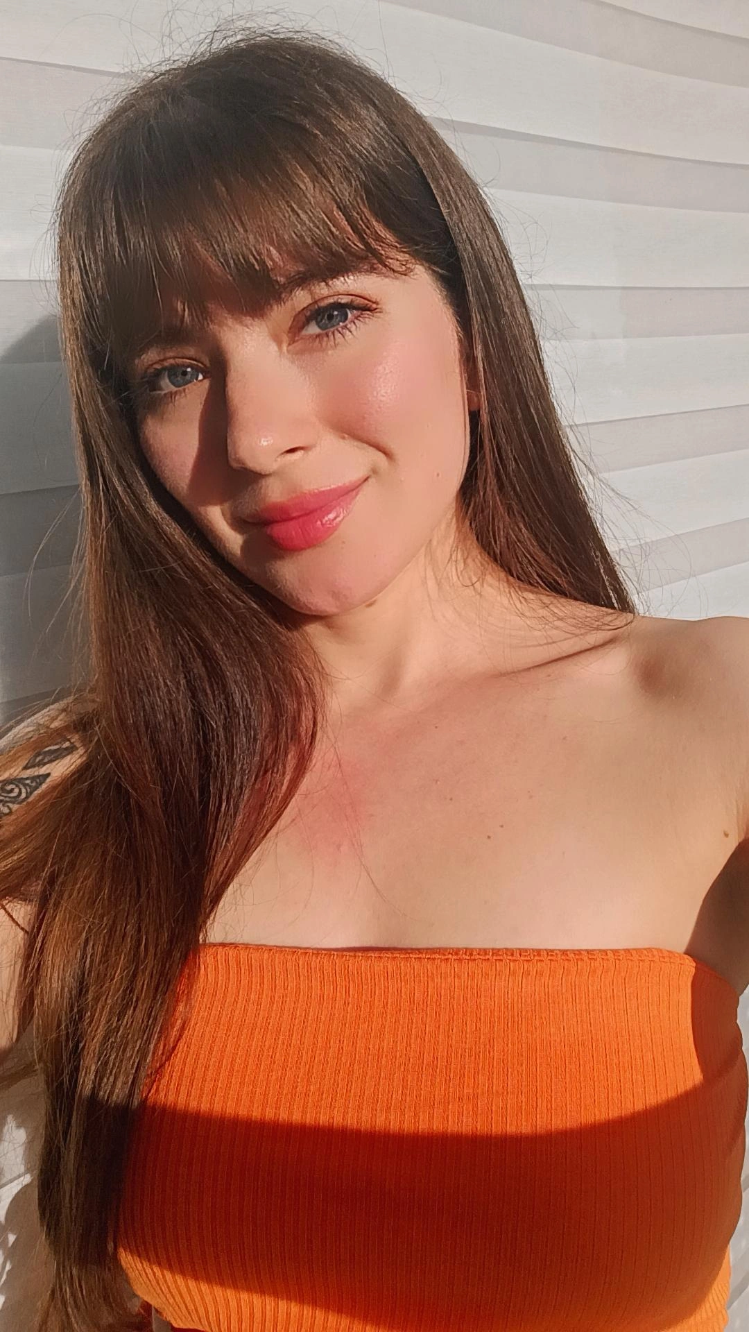 Woman smiling while explaining cam to cam video chat