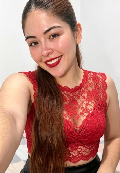 Woman smiling during a private evening video conversation