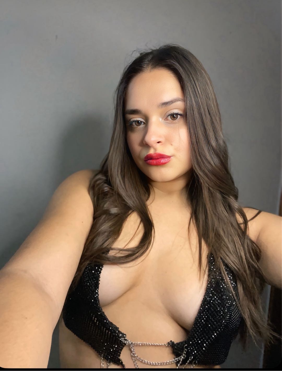 Woman with a steady gaze beside video chat safety answers